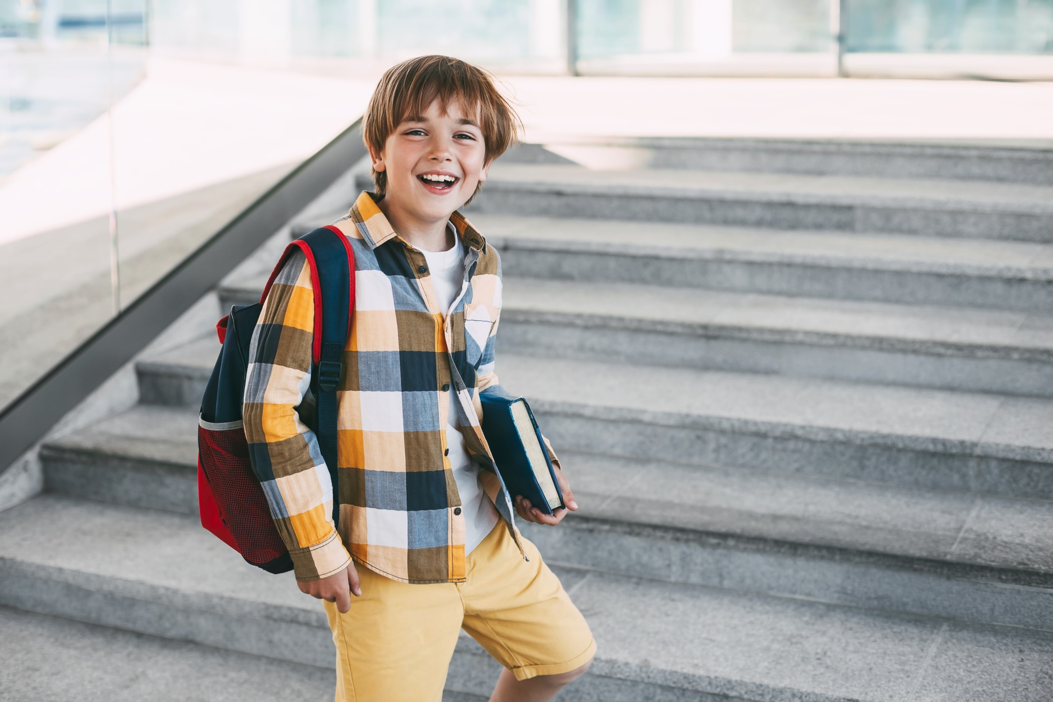 happy-boy-with-a-backpack-and-a-book-goes-to-school-beginning-of-the-new-school-year-after-the-summer_t20_A93Ap1